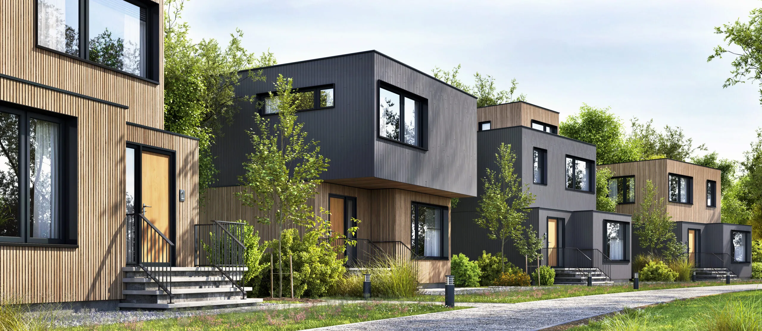 黒い箱型の3階建て住宅の外観